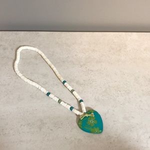 9.5” Hawaiian puka shell necklace with floral heart
